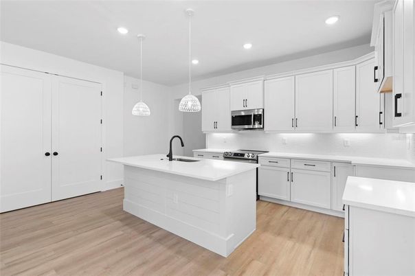 Interior, Kitchen, Pendant Lights, Recessed Lighting, Stainless Steel Appliances, Wood Texture Flooring
