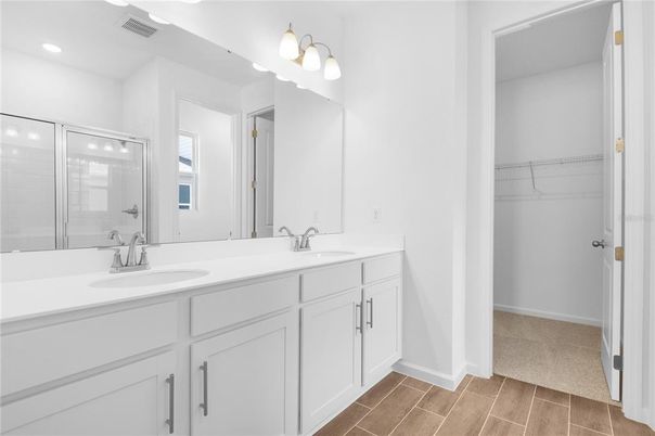 Bathroom, Dual Sink Vanities, Glass Shower, Interior, Recessed Lighting, Walk-in Closets, Wood Texture Flooring