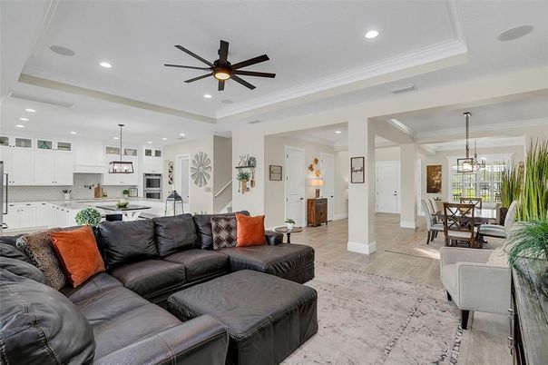 Chandelier, Dining room, Interior, Kitchen, Living room, Pendant Lights, Recessed Lighting, Stainless Steel Appliances, Wood Texture Flooring