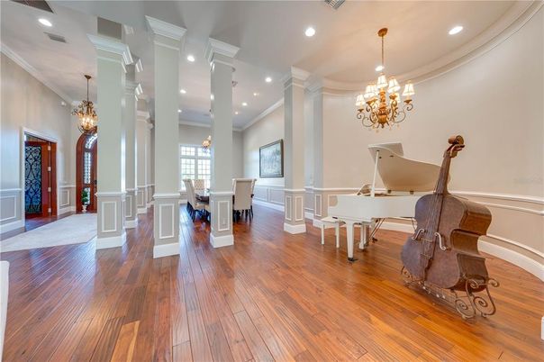 Chandelier, Dining room, Interior, Pendant Lights, Piano, Recessed Lighting, Wood Texture Flooring