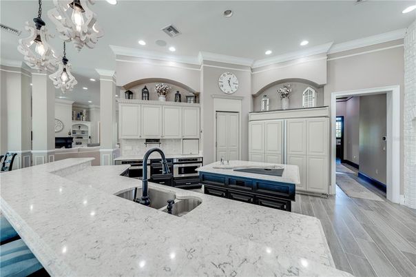 Chandelier, Interior, Kitchen, Recessed Lighting, Stainless Steel Appliances, Wood Texture Flooring