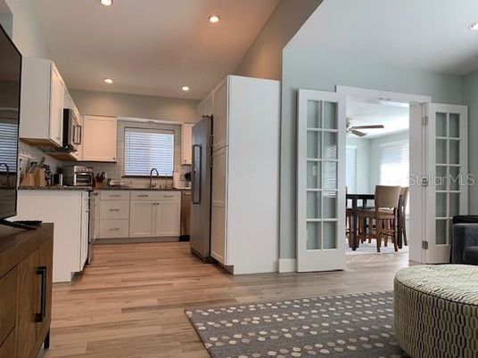 Dining room, Interior, Kitchen, Recessed Lighting, Stainless Steel Appliances, Wood Texture Flooring