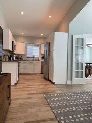 Interior, Kitchen, Recessed Lighting, Stainless Steel Appliances, Wood Texture Flooring