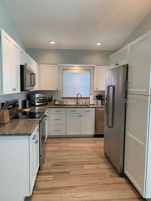 Interior, Kitchen, Recessed Lighting, Stainless Steel Appliances, Wood Texture Flooring