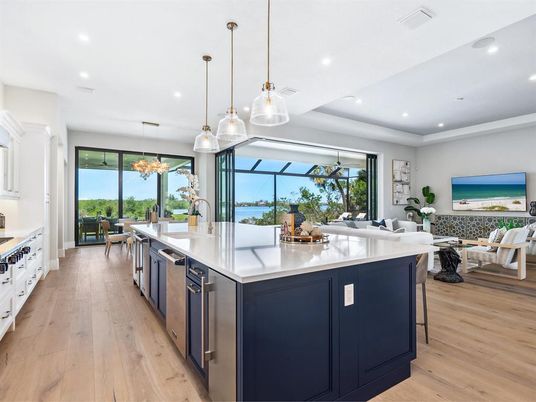 Dining room, Interior, Kitchen, Living room, Pendant Lights, Recessed Lighting, Stainless Steel Appliances, Water, Wood Texture Flooring