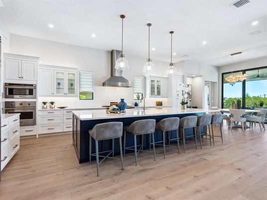 Dining room, Interior, Kitchen, Pendant Lights, Recessed Lighting, Stainless Steel Appliances, Wood Texture Flooring