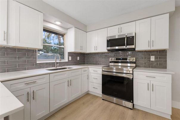 Interior, Kitchen, Recessed Lighting, Stainless Steel Appliances, Wood Texture Flooring