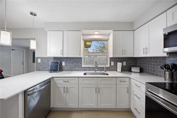 Interior, Kitchen, Pendant Lights, Recessed Lighting, Stainless Steel Appliances, Wood Texture Flooring