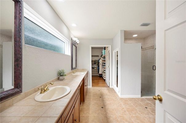 Bathroom, Dual Sink Vanities, Glass Shower, Interior, Recessed Lighting, Tile Countertops, Walk-in Closets