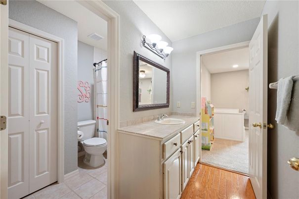 Bathroom, Interior, Recessed Lighting, Tile Countertops, Wood Texture Flooring