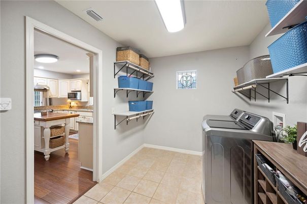Interior, Kitchen, Recessed Lighting, Washer, Wood Texture Flooring