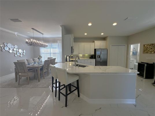 Chandelier, Dining room, Interior, Kitchen, Marble, Pendant Lights, Recessed Lighting, Stainless Steel Appliances