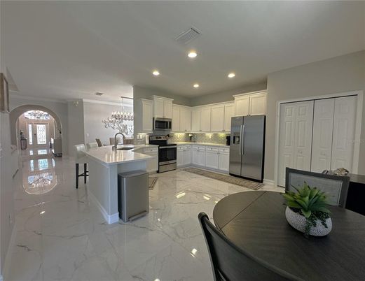 Dining room, Interior, Kitchen, Marble, Pendant Lights, Recessed Lighting, Stainless Steel Appliances