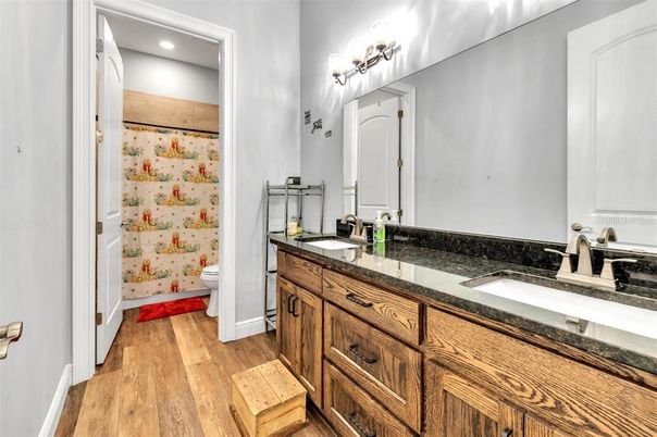Bathroom, Dual Sink Vanities, Interior, Recessed Lighting, Wood Texture Flooring