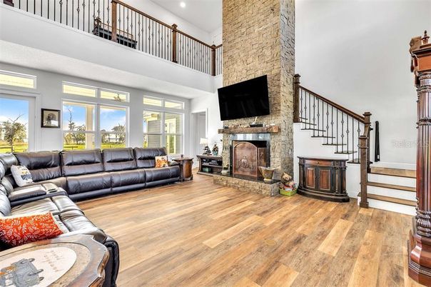 Fireplace, Interior, Living room, Recessed Lighting, Stone Walls, Wood Texture Flooring