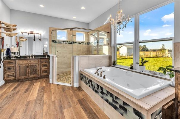 Bathroom, Chandelier, Glass Shower, Interior, Recessed Lighting, Wood Texture Flooring