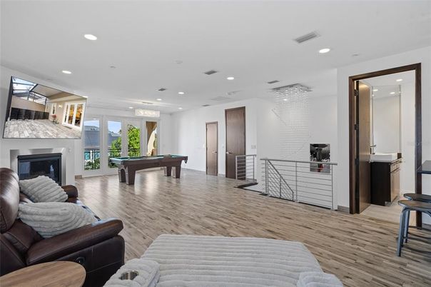 Billiard Table, Fireplace, Game Room, Interior, Pendant Lights, Recessed Lighting, Wood Texture Flooring