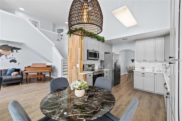 Dining room, Interior, Kitchen, Pendant Lights, Piano, Recessed Lighting, Stainless Steel Appliances, Wood Texture Flooring