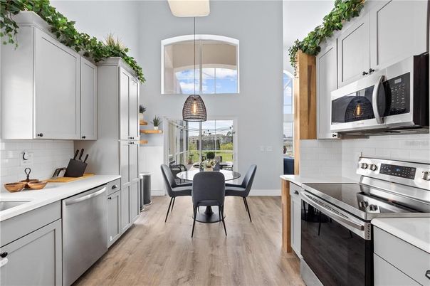 Dining room, Interior, Kitchen, Pendant Lights, Stainless Steel Appliances, Wood Texture Flooring
