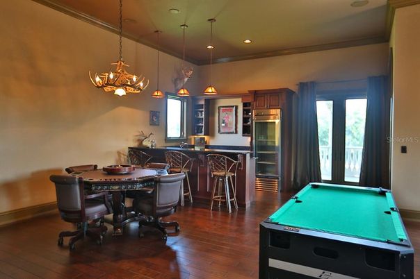 Billiard Table, Chandelier, Dining room, Game Room, Interior, Pendant Lights, Recessed Lighting, Wood Texture Flooring