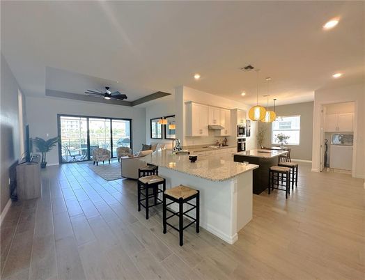 Dining room, Interior, Kitchen, Living room, Pendant Lights, Recessed Lighting, Stainless Steel Appliances, Wood Texture Flooring