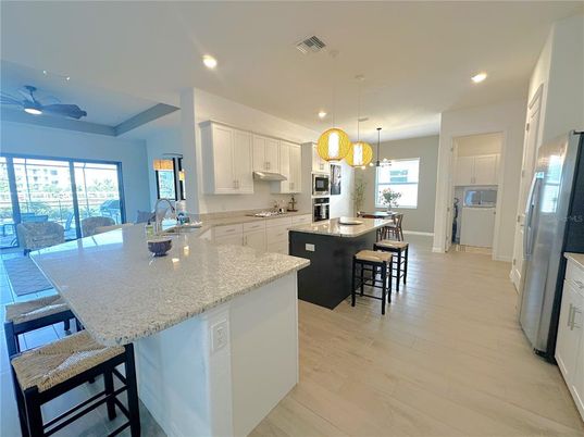 Dining room, Interior, Kitchen, Pendant Lights, Recessed Lighting, Stainless Steel Appliances, Wood Texture Flooring