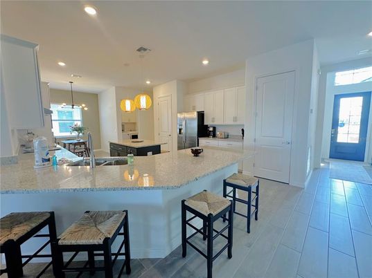Dining room, Interior, Kitchen, Pendant Lights, Recessed Lighting, Stainless Steel Appliances, Wood Texture Flooring