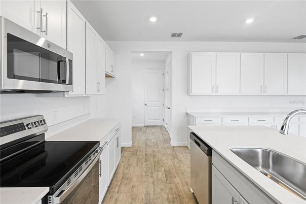 Interior, Kitchen, Recessed Lighting, Stainless Steel Appliances, Wood Texture Flooring