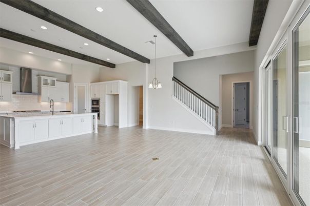 Empty room, Interior, Kitchen, Pendant Lights, Recessed Lighting, Stainless Steel Appliances, Wooden Beams, Wood Texture Flooring