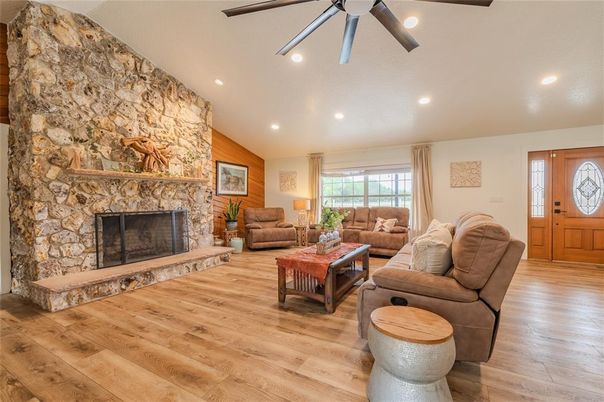 Fireplace, Interior, Living room, Recessed Lighting, Stone Walls, Wood Texture Flooring