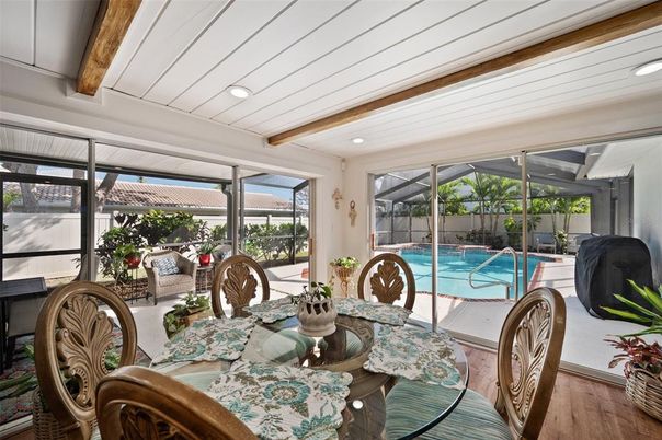 Dining room, Interior, Pool, Recessed Lighting, Sun Room, Wooden Beams, Wood Texture Flooring
