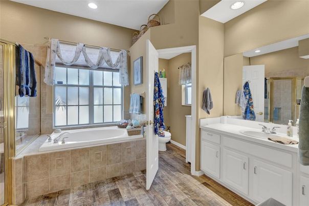 Bathroom, Dual Sink Vanities, Interior, Recessed Lighting, Wood Texture Flooring