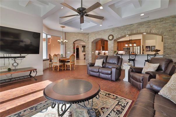 Chandelier, Dining room, Interior, Kitchen, Living room, Pendant Lights, Recessed Lighting, Stone Walls, Wood Texture Flooring