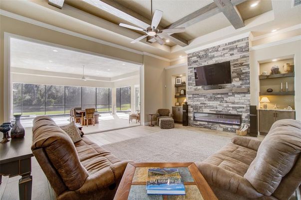 Fireplace, Interior, Living room, Recessed Lighting, Stone Walls, Wood Texture Flooring