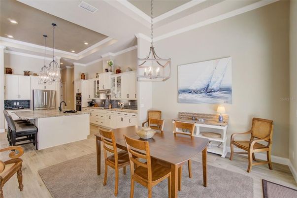 Chandelier, Dining room, Interior, Kitchen, Pendant Lights, Recessed Lighting, Stainless Steel Appliances, Wood Texture Flooring