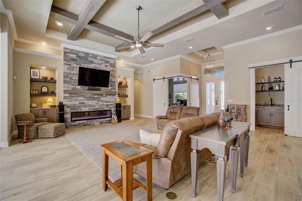Fireplace, Interior, Living room, Pendant Lights, Recessed Lighting, Stone Walls, Wooden Beams, Wood Texture Flooring