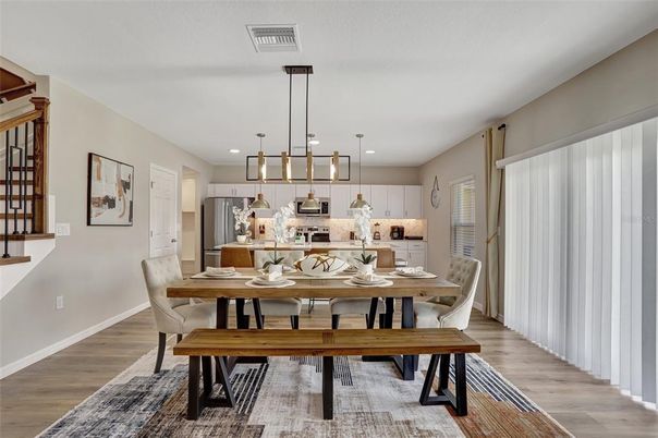 Dining room, Interior, Kitchen, Pendant Lights, Recessed Lighting, Stainless Steel Appliances, Wood Texture Flooring