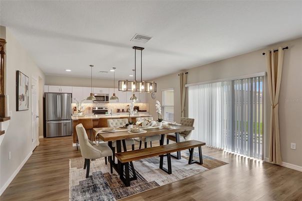 Dining room, Interior, Kitchen, Pendant Lights, Recessed Lighting, Stainless Steel Appliances, Wood Texture Flooring