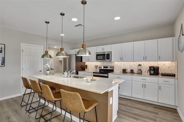 Interior, Kitchen, Pendant Lights, Recessed Lighting, Stainless Steel Appliances, Wood Texture Flooring