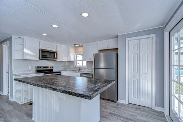 Interior, Kitchen, Recessed Lighting, Stainless Steel Appliances, Wood Texture Flooring