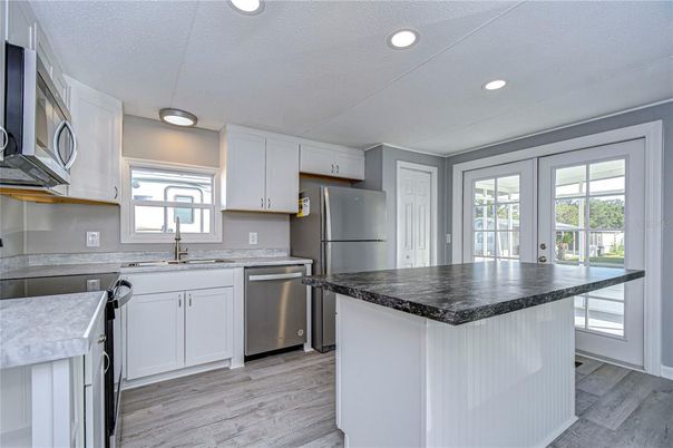 Interior, Kitchen, Recessed Lighting, Stainless Steel Appliances, Wood Texture Flooring