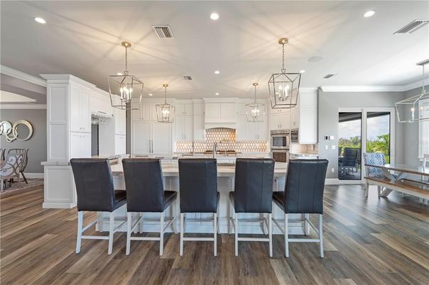 Dining room, Interior, Kitchen, Pendant Lights, Recessed Lighting, Stainless Steel Appliances, Wood Texture Flooring