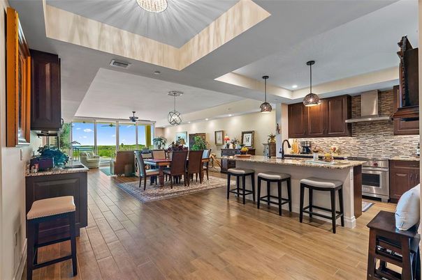 Dining room, Interior, Kitchen, Pendant Lights, Recessed Lighting, Stainless Steel Appliances, Wood Texture Flooring