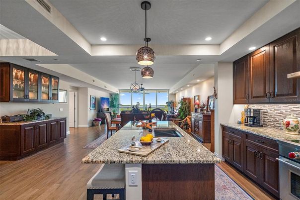 Dining room, Interior, Kitchen, Pendant Lights, Recessed Lighting, Stainless Steel Appliances, Wood Texture Flooring