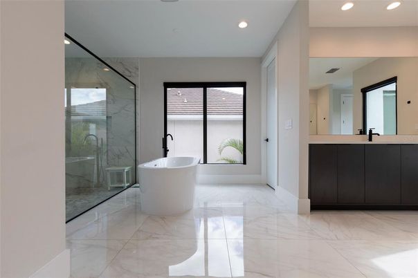 Bathroom, Free Standing Baths, Glass Shower, Interior, Marble, Marble Walls, Recessed Lighting