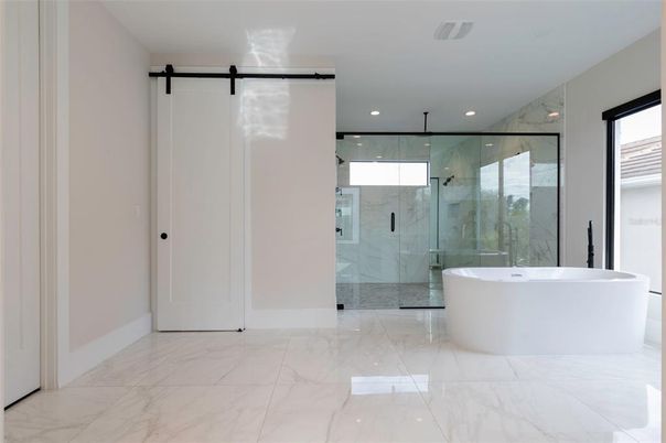 Bathroom, Free Standing Baths, Glass Shower, Interior, Marble, Marble Walls, Recessed Lighting