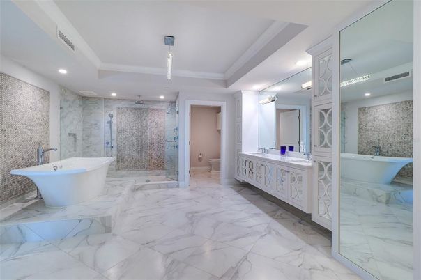 Bathroom, Dual Sink Vanities, Free Standing Baths, Glass Shower, Interior, Marble, Marble Walls, Pendant Lights, Recessed Lighting