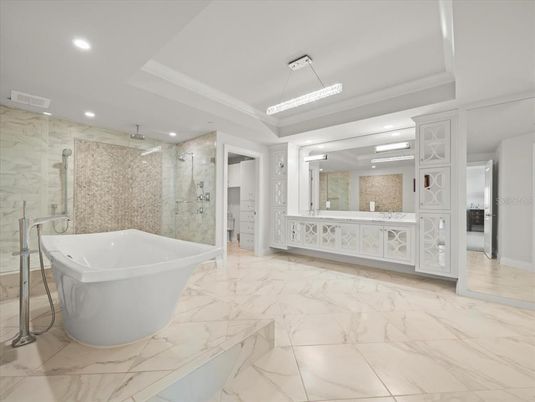 Bathroom, Free Standing Baths, Glass Shower, Interior, Marble, Marble Walls, Pendant Lights, Recessed Lighting