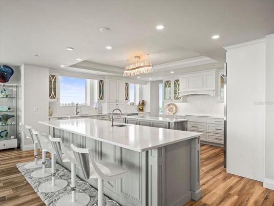 Chandelier, Interior, Kitchen, Pendant Lights, Recessed Lighting, Stainless Steel Appliances, Wood Texture Flooring