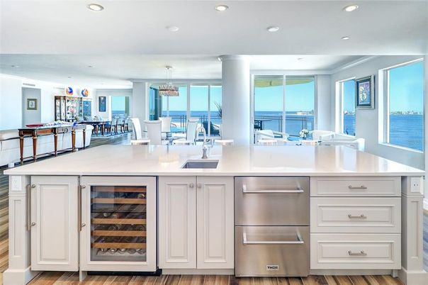 Dining room, Interior, Kitchen, Pendant Lights, Recessed Lighting, Stainless Steel Appliances, Water, Wood Texture Flooring